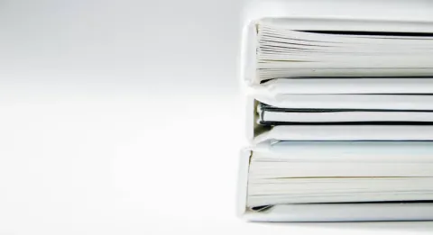 Binders arrayed on a white background