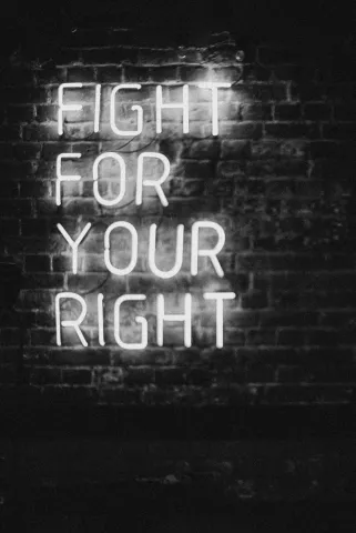 A neon sign reads fight for your right